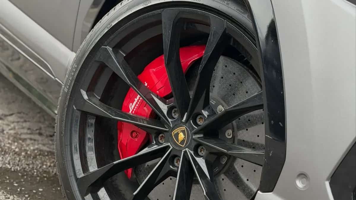 Red painted brake calipers on a gray Lamborghini Urus