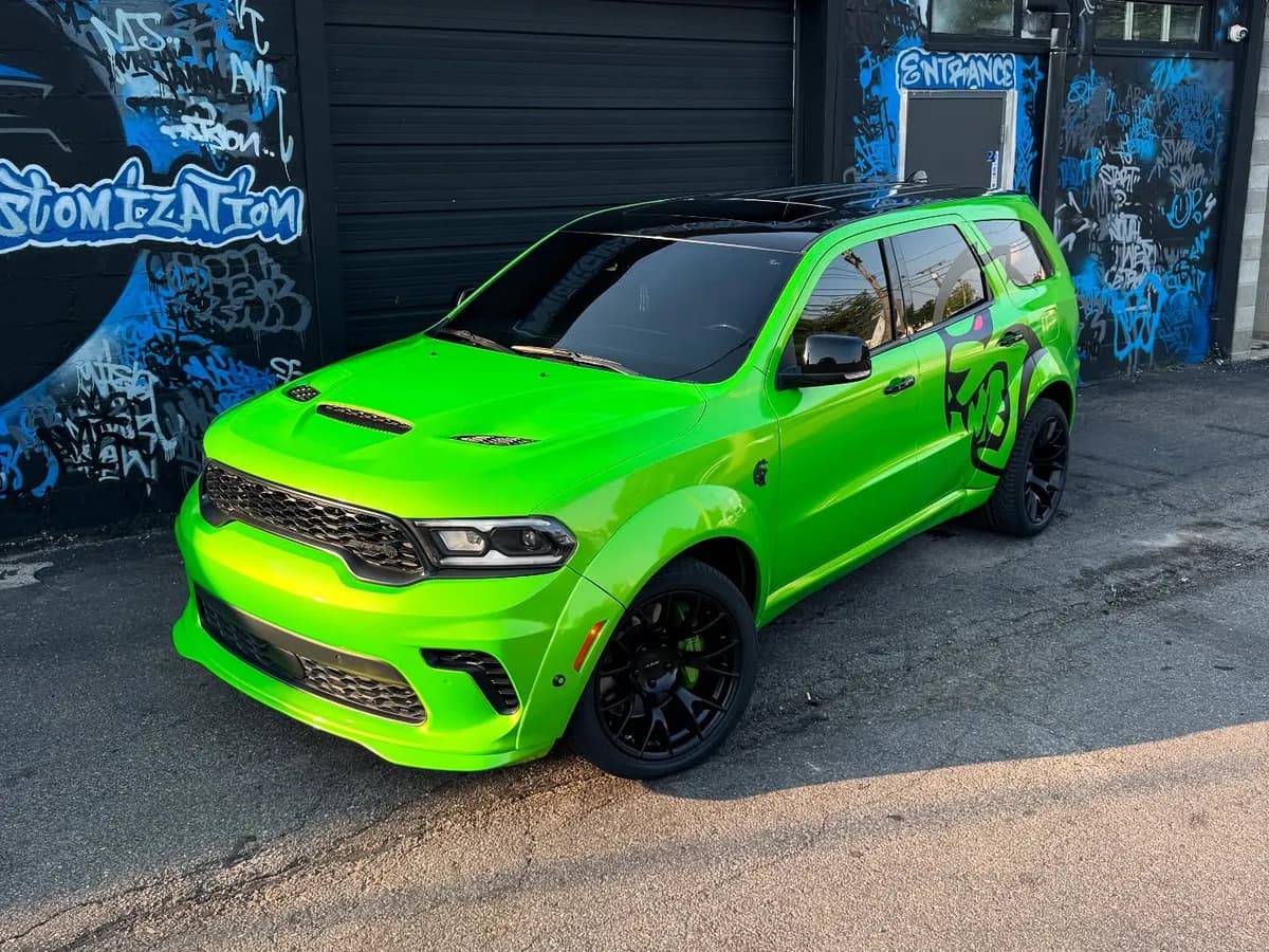 Lime green Dodge Durango build outside Buff X Customization in Dearborn Heights