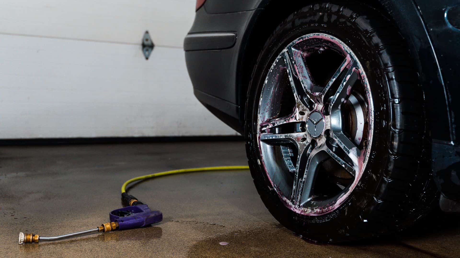 Wheel being cleaned during a car detail